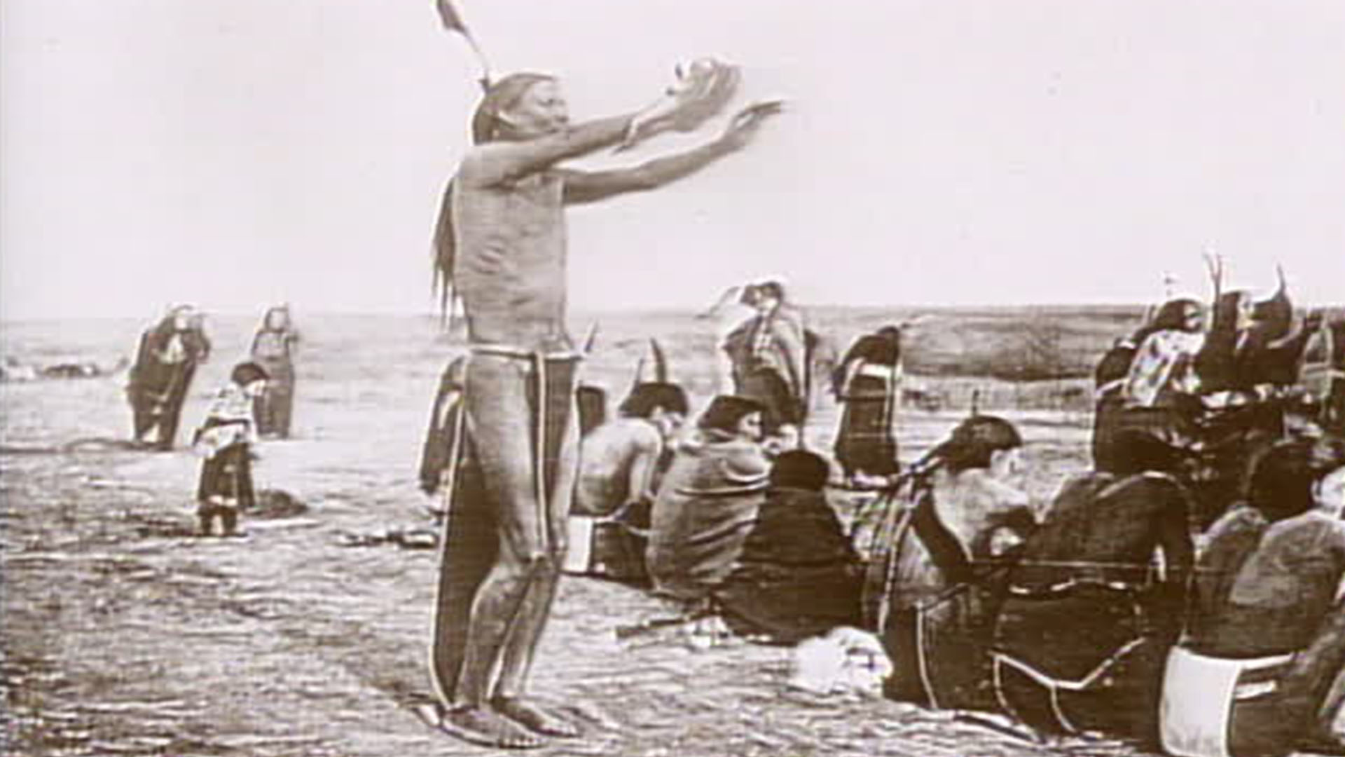 a black-and-white photo a native american speaking to his people